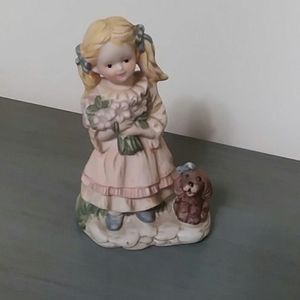 Vintage girl and puppy figurine.
